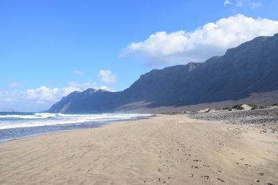 Scenic view of beach against sky