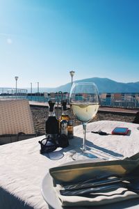 Beer on table against clear sky