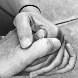 Close-up of couple holding hands