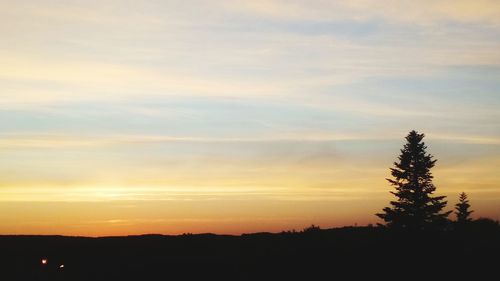 Scenic view of silhouette landscape against sky during sunset