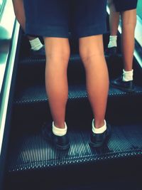 Low section of woman standing on steps