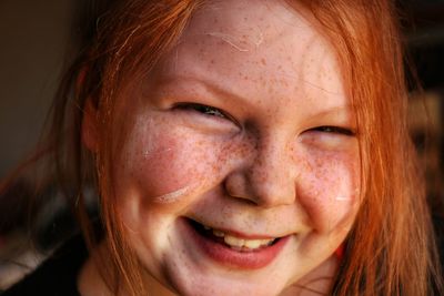 Close-up portrait of smiling girl