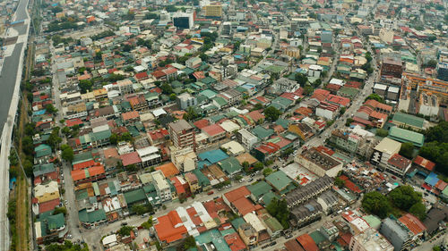 Manila city view from above with streets and buildings in the makati business center.. 