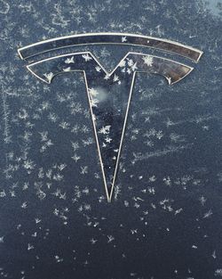 High angle view of arrow symbol on metal