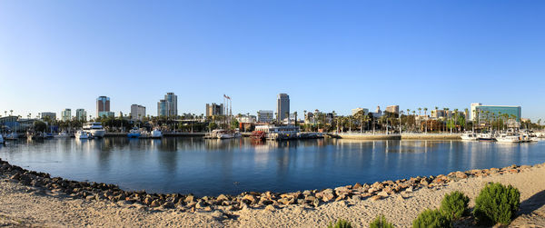 Panoramic view of buildings in city against clear sky