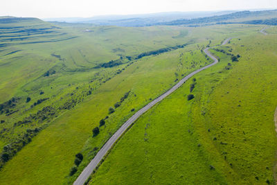 Above view of countryside road, aerial drone view