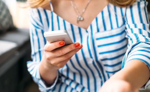 Close-up of woman using smart phone