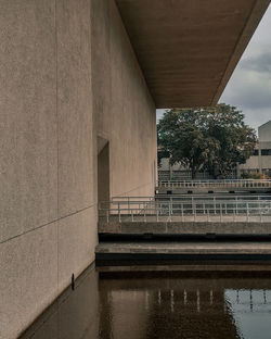 Bridge over river against building