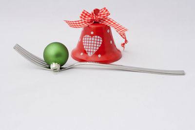 High angle view of christmas decoration on table against white background