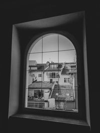Buildings seen through glass window