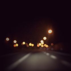 Illuminated road at night