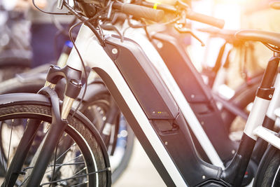 Close-up of bicycle parked in row