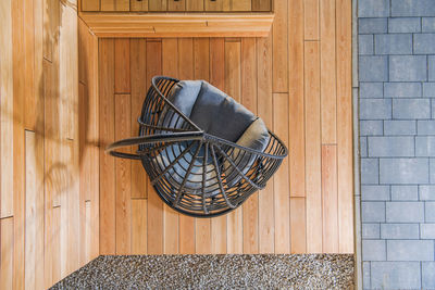 Outdoor patio seat on the brand new elegant backyard garden exotic wood made deck. top view.