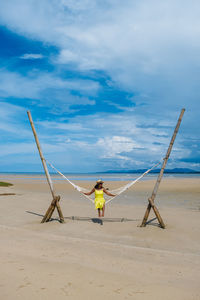 Man on beach against sky