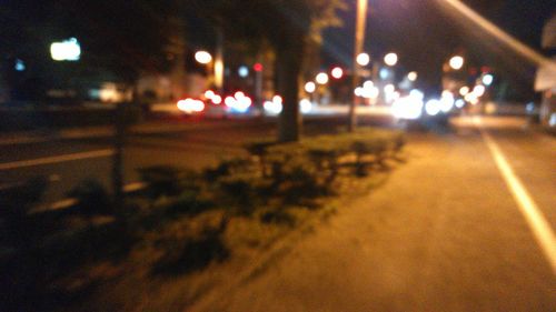 Close-up of illuminated road at night