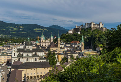 Buildings in town against sky