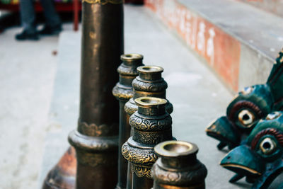 Close-up of religious bowls in temple