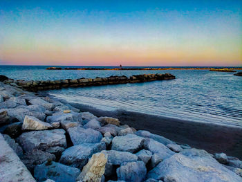 Scenic view of sea against sky during sunset