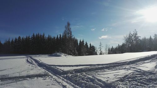Scenic view of snow covered landscape against sky