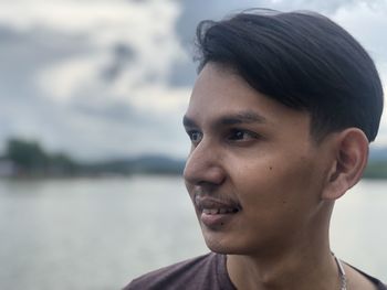 Portrait of young man looking away