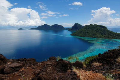 Scenic view of sea against cloudy sky