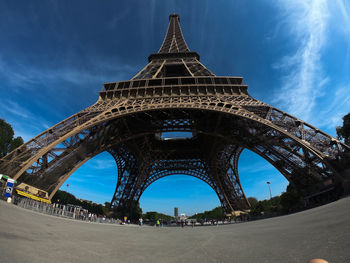 Low angle view of tower against cloudy sky