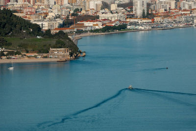 High angle view of buildings by sea