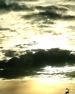 Low angle view of cloudy sky during sunset