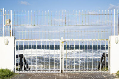 White closed gates to the beach due to large waves. mahdia, tunisia. empty places and quarantine