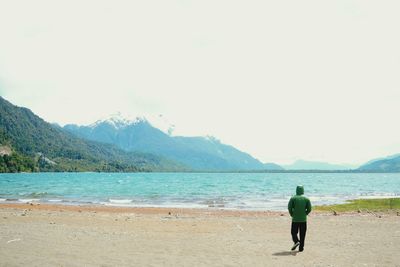 Full length of man on beach against sky