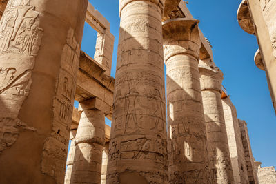 Different hieroglyphs on the walls and columns in the karnak temple.