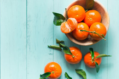 High angle view of orange fruits on table