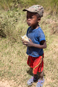 Boy wearing hat on field