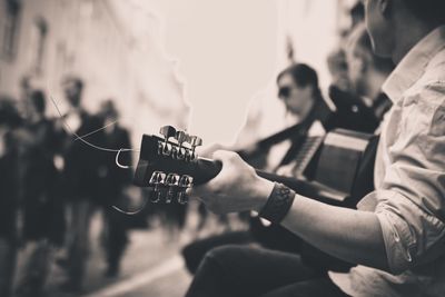 Cropped image of woman holding sunglasses