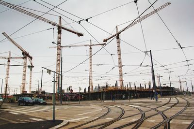 View of railroad tracks in city against sky