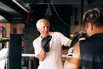 Men boxing in gym