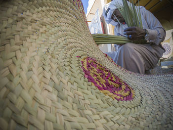 High angle view of hat on wicker basket