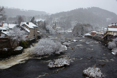 High angle view of houses and trees during winter