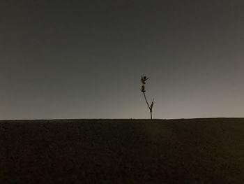 Scenic view of land against sky during sunset
