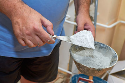 Midsection of man holding ice cream