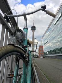 Bicycles against sky in city