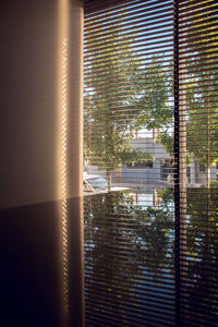 Close-up of building seen through window