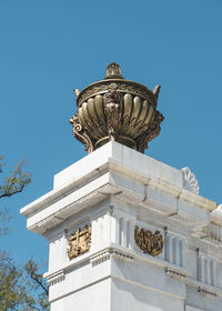 Low angle view of statue against clear blue sky