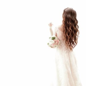 Woman looking away over white background