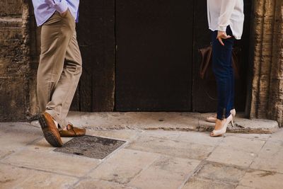 Low section of people standing on footpath