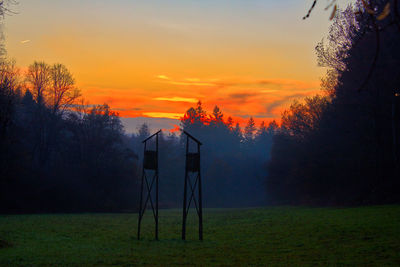 Scenic view of field against sky during sunset