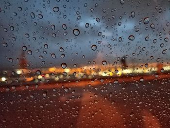 Full frame shot of raindrops on window