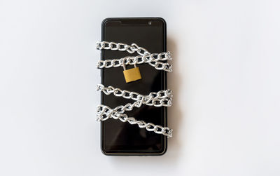 Close-up of telephone booth against white background