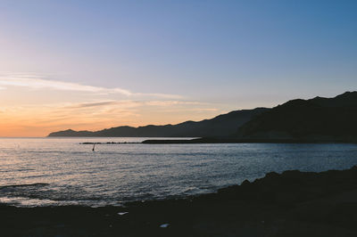 Scenic view of sea against sky during sunset