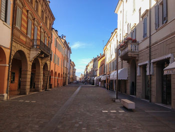 Street amidst buildings in italian city